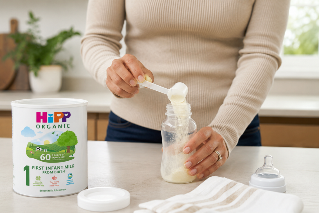 Woman measuring powdered formula into a bottle